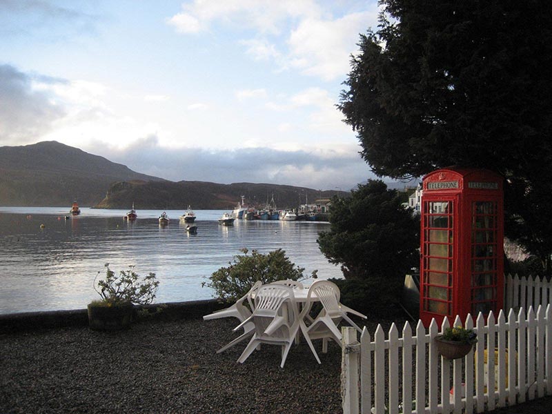 Portree Bay House Skye - Beach-front garden with telephone box - unique places to stay in Scotland
