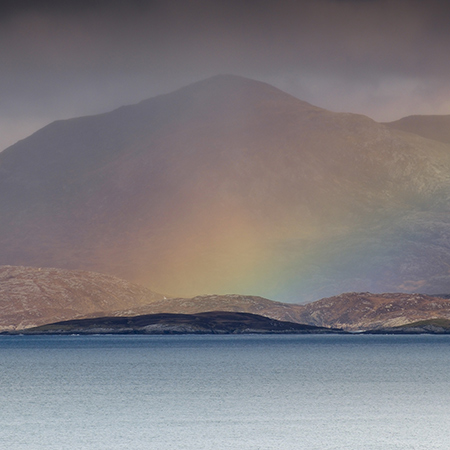Christopher Swan: Harris in the Spring - rainbow over the sea & mountain bacdrop