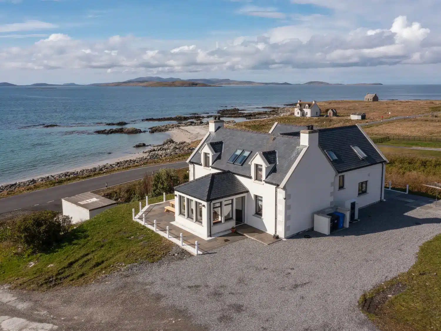 white house by turquoise sea Driftwood South Uist