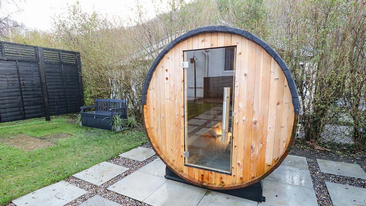 Island view house barrel sauna in garden