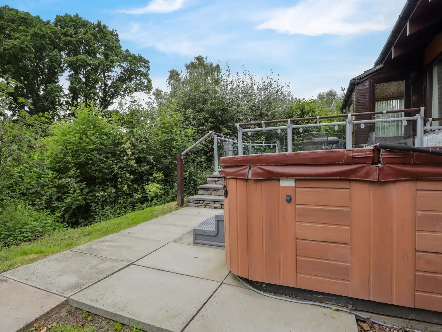 hot tub at Katchana lodge on patio overlooking trees