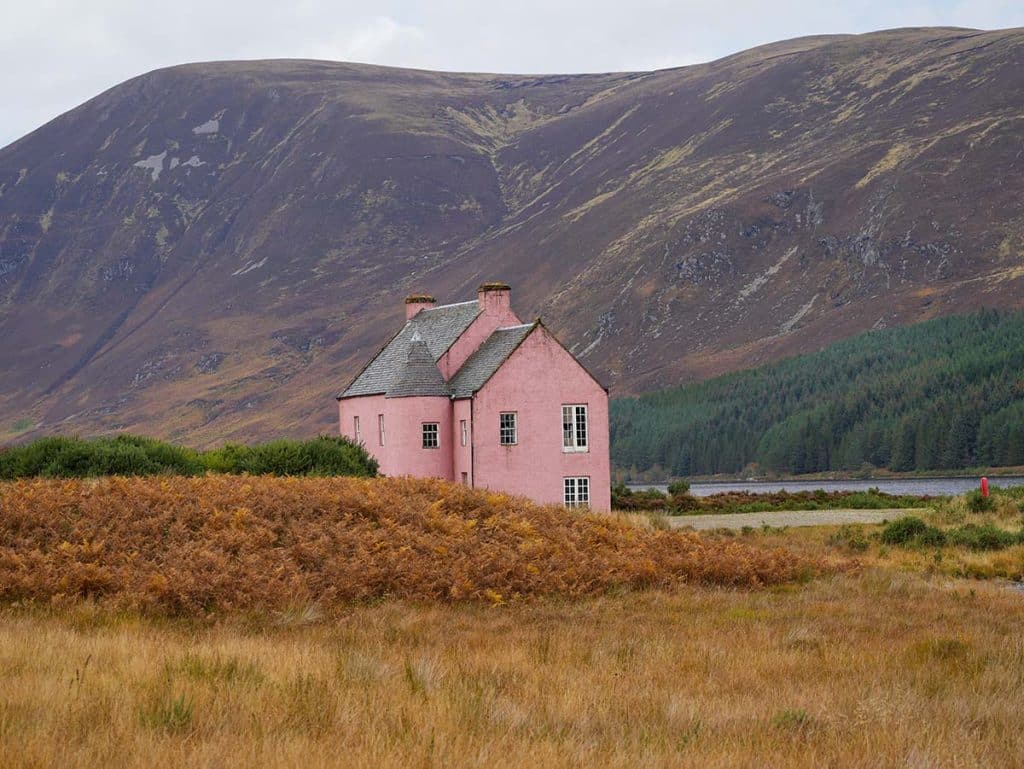 Pink House with mountain backdrop